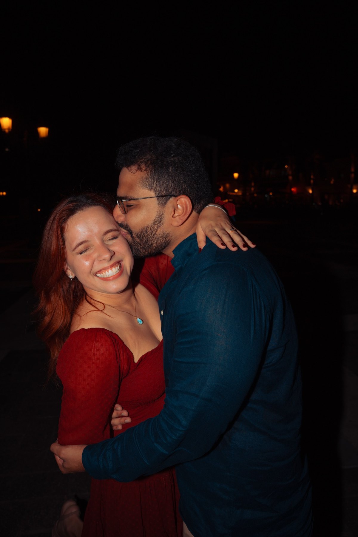 A couple embracing at night