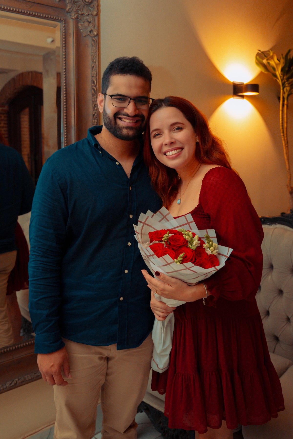 Couple posing with a bouquet